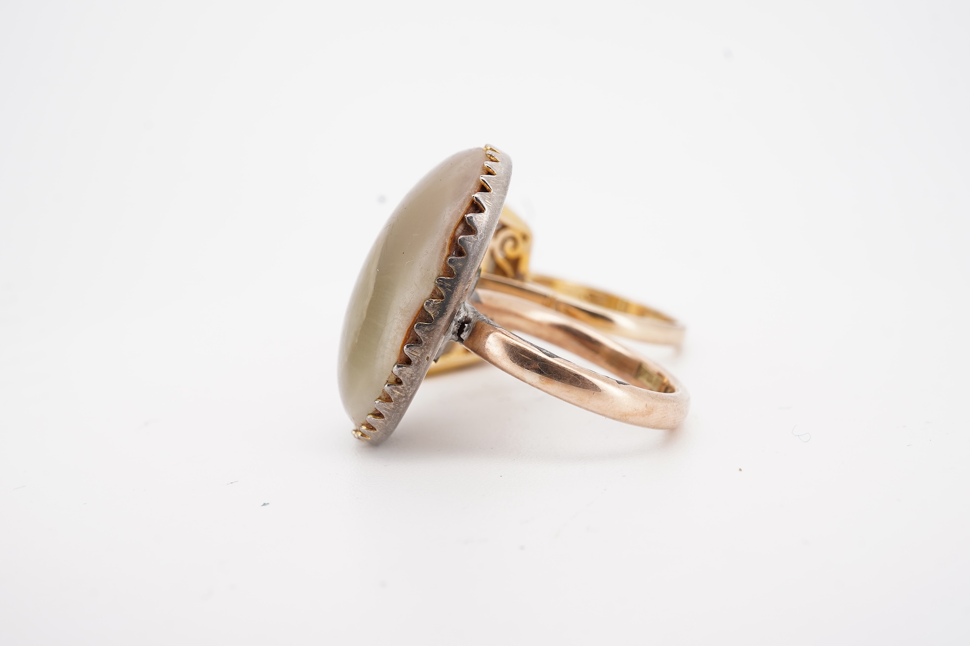 A modern 9ct gold and single stone emerald cut smoky quartz set ring, size N and one other 1960's 9ct gold shank, with a later added agate set white metal mount.